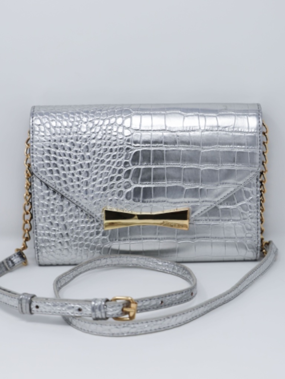 Betsey Johnson metallic silver crocodile embossed crossbody bag with a gold chai